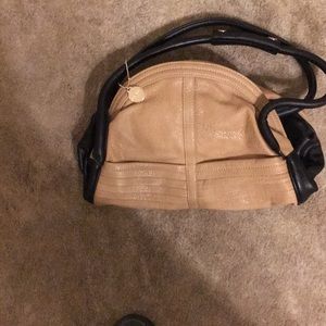 Beautiful tan bag with Lepard  lining